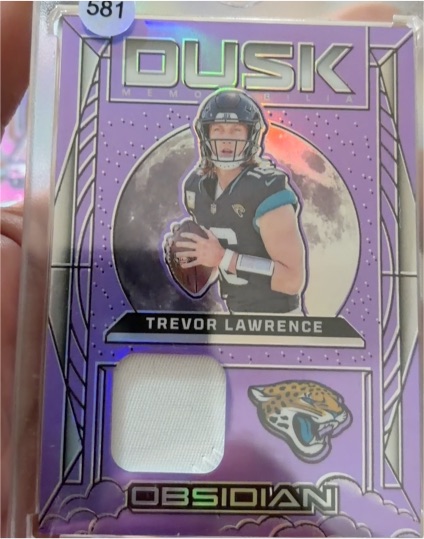 2024 Panini Obsidian #DM-TLE Trevor Lawrence — front