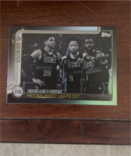 2025-26 Topps #279 Pistons Rain 3 Pointers Pistons Shoot Lights Out Blackout Parallel — front