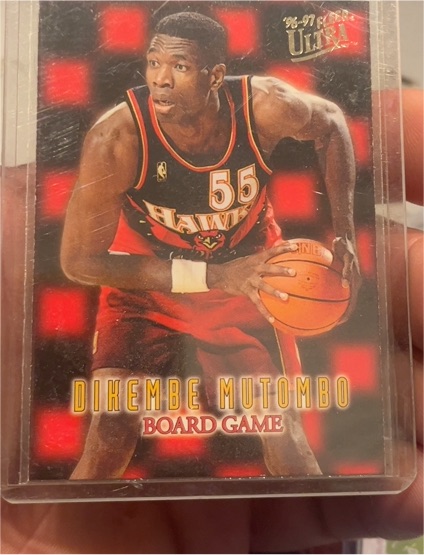 1996-97 Fleer Ultra #12 Dikembe Mutombo Board Game — front
