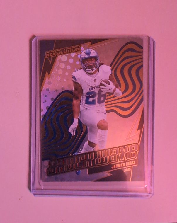 2025 Panini Revolution Shockwave #18 Jahmyr Gibbs — front