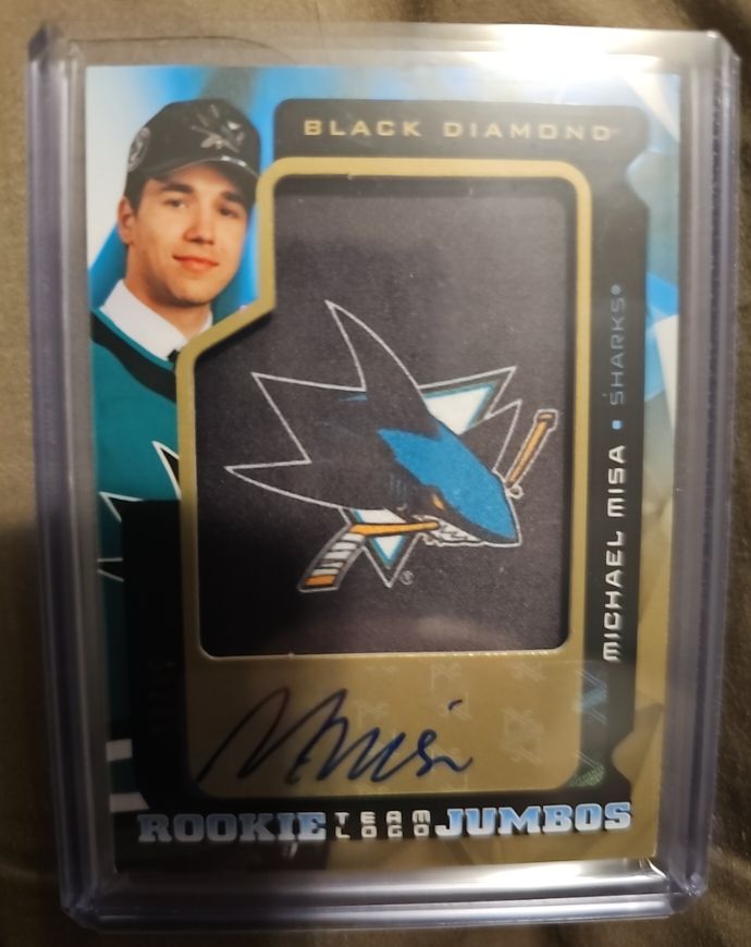 2025-26 Upper Deck Black Diamond #RTL-MI Michael Misa Rookie Team Logo Jumbos — front