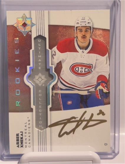 2022-23 Upper Deck Ultimate Collection Emblems #UE-AX Arber Xhekaj Rookie Auto — front
