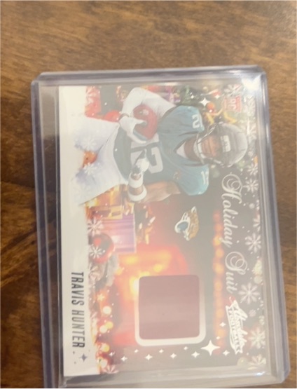 2025 Panini Absolute #HS-THR Travis Hunter Holiday Suit Rookie Patch Card — front