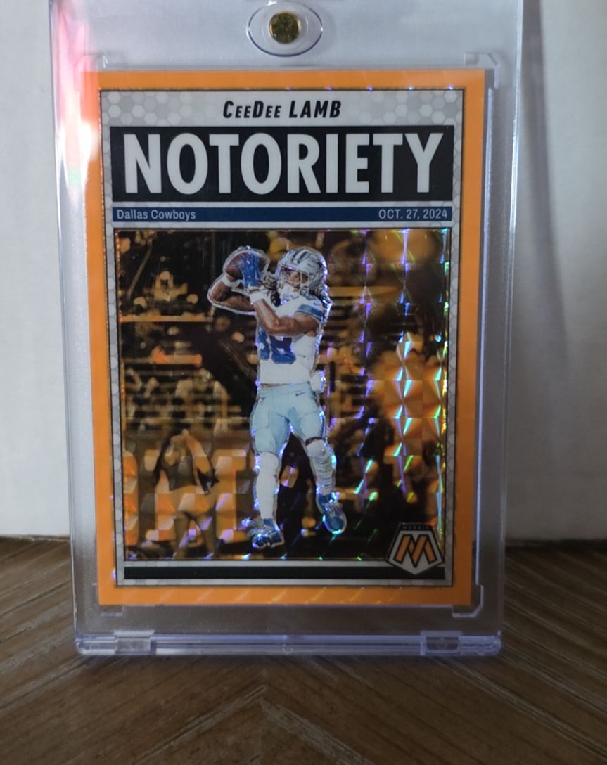 2025 Panini Mosaic #8 CeeDee Lamb Notoriety Mosaic Orange Fluorescent — front