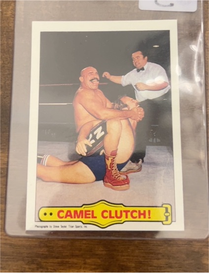 1985 Topps WWF #49 Iron Sheik Camel Clutch! — front