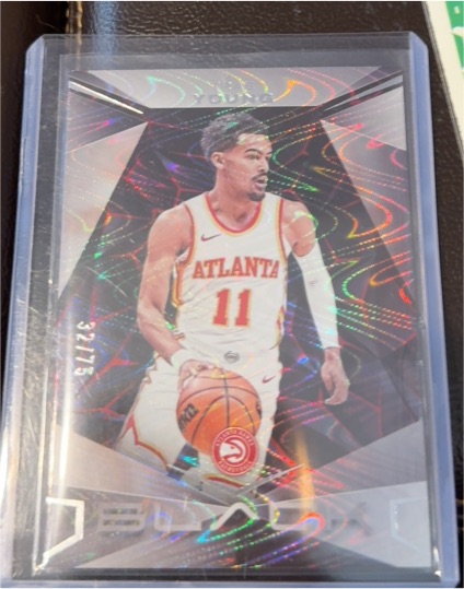 2023-24 Panini Black #9 Trae Young — front