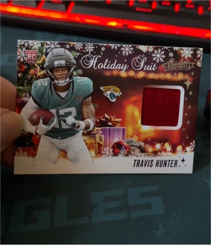 2025 Panini Absolute #HS-THR Travis Hunter Holiday Suit Rookie Patch — front