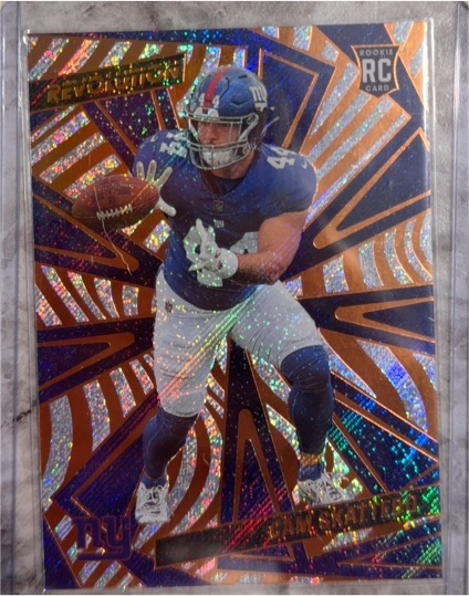 2025 Panini Revolution #207 Cam Skattebo — front