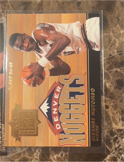 1994-95 Fleer #4 Dikembe Mutombo NBA League Leaders — front