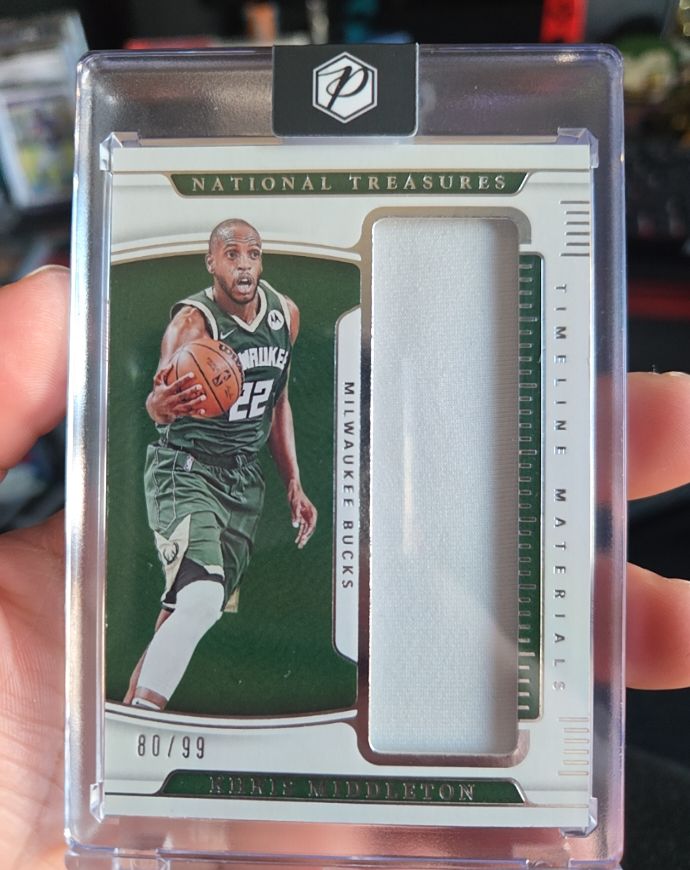 2021-22 Panini National Treasures Timeline Materials #TM-KM Khris Middleton — front