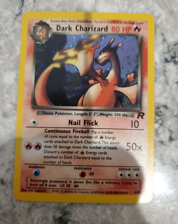 1999 Pokémon Team Rocket #4 Dark Charizard — front