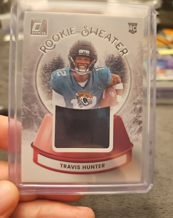 2025 Donruss #SWE-THR Travis Hunter Rookie Sweaters — front