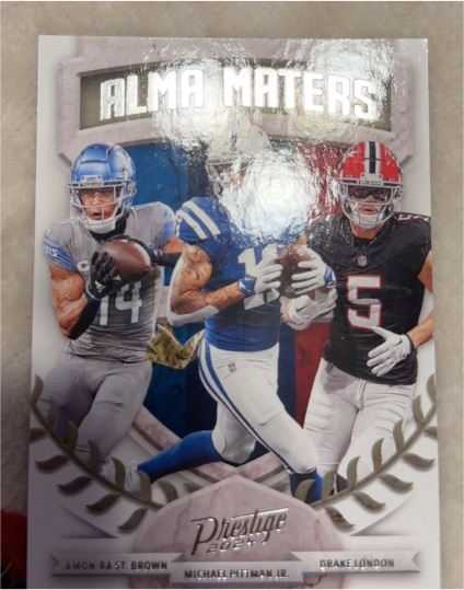 2024 Panini Prestige #1 Amon-Ra St. Brown Michael Pittman Jr. Drake London Alma Maters — front