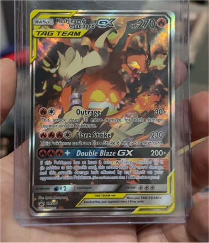 2019 Pokémon SM Promos #SM201 Reshiram & Charizard GX — front