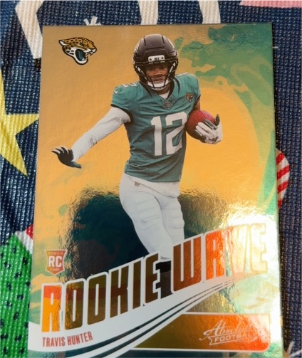 2025 Panini Absolute Rookie Wave #RW-THR Travis Hunter — front