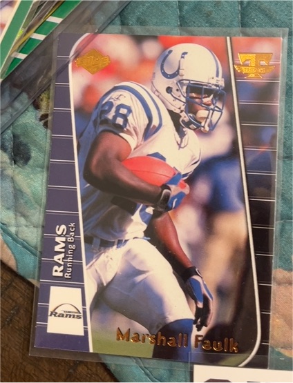 1999 Collector's Edge Triumph #T6 Marshall Faulk — front
