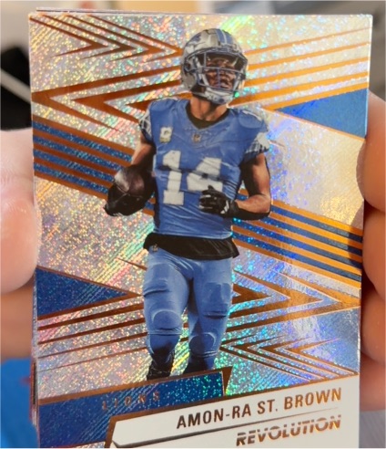 2025 Panini Revolution #180 Amon-Ra St. Brown — front