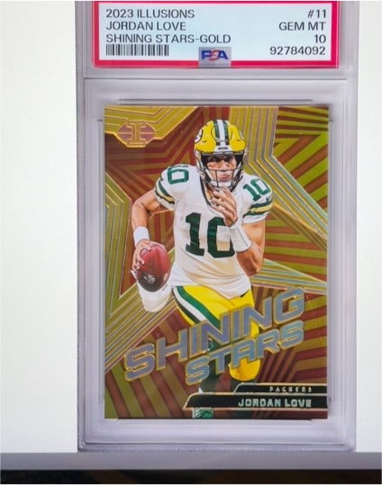 2023 Panini Illusions #11 Jordan Love Shining Stars Gold — front