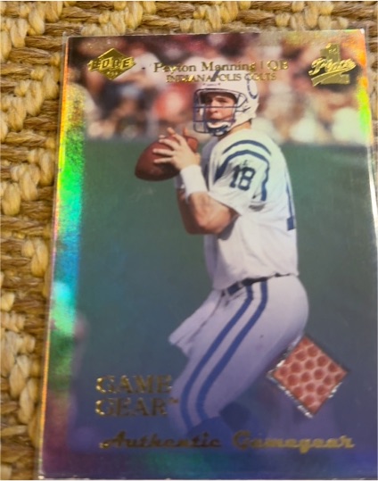 1999 Collector's Edge 1st Place Peyton Manning Game Gear Football #PM — front