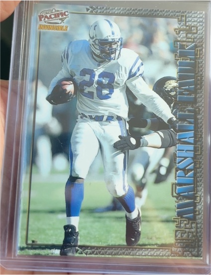 1997 Pacific Invincible Smash Mouth X-tra #31 Marshall Faulk — front