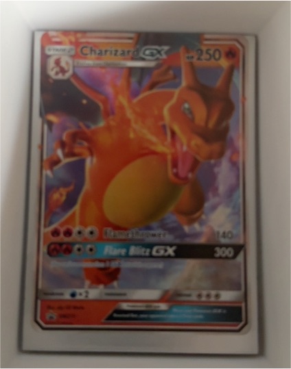 2019 Pokémon TCG SM Black Star Promo #SM211 Charizard GX — front