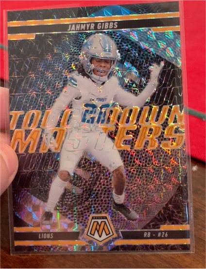 2025 Panini Mosaic #6 Jahmyr Gibbs Touchdown Masters Orange Fluorescent — front