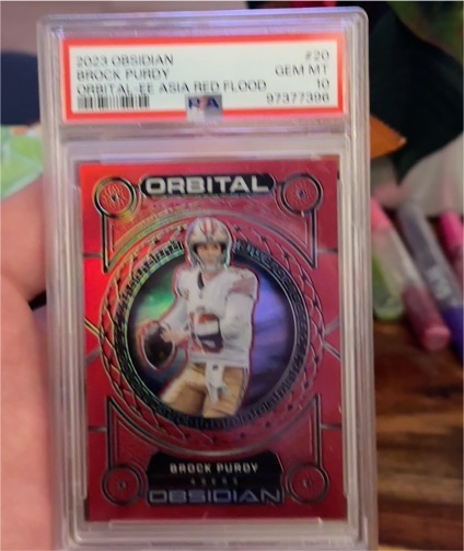2023 Panini Obsidian #20 Brock Purdy Orbital Asia Red Flood — front