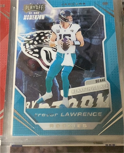 2021 Panini Chronicles Playoff Momentum Rookies #PMR-1 Trevor Lawrence — front