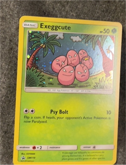 2017 Pokémon SM Black Star Promo #SM119 Exeggcute — front