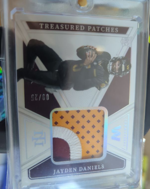2023 Panini National Treasures Treasured Patches #09 Jayden Daniels — front