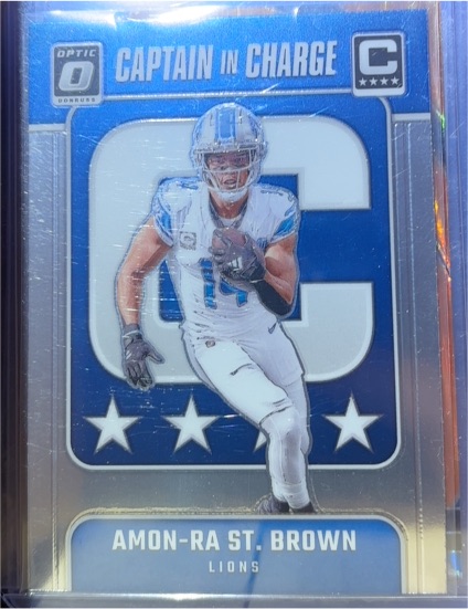 2024 Donruss Optic #5 Amon-Ra St. Brown Captain In Charge — front