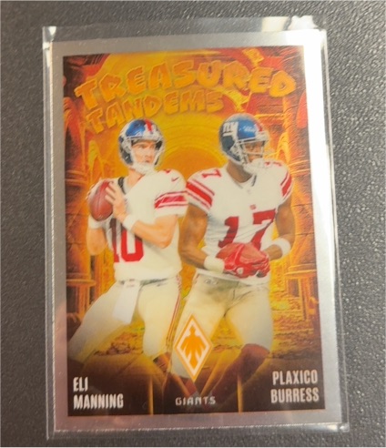 2024 Panini Phoenix #TT-NYG Eli Manning / Plaxico Burress Treasured Tandems — front