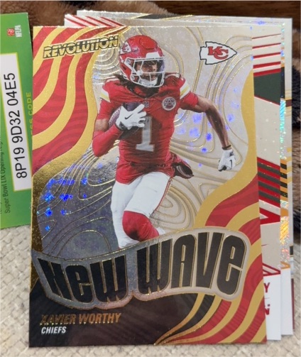 2025 Panini Revolution #25 Xavier Worthy New Wave — front