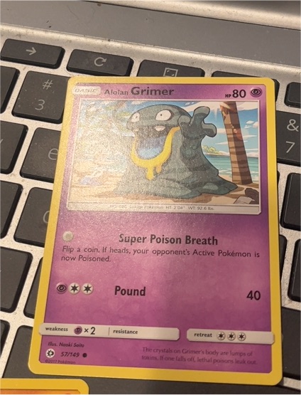 2017 Pokémon TCG Sun & Moon #57 Alolan Grimer — front