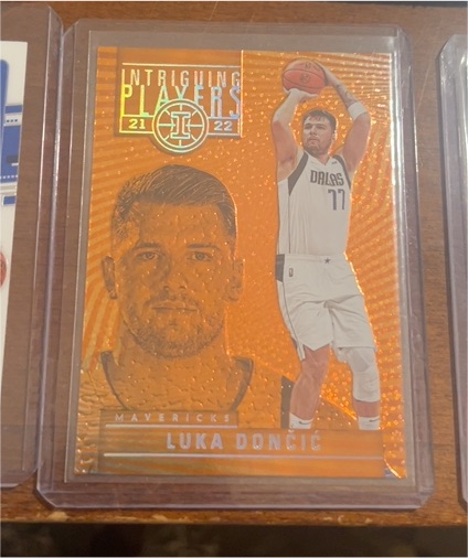 2021-22 Panini Illusions Intriguing Players Orange #9 Luka Dončić — front