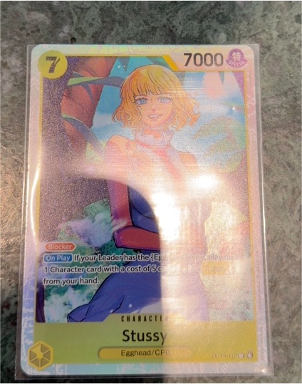 One Piece TCG OP13-110 Stussy Carrying On His Will — front
