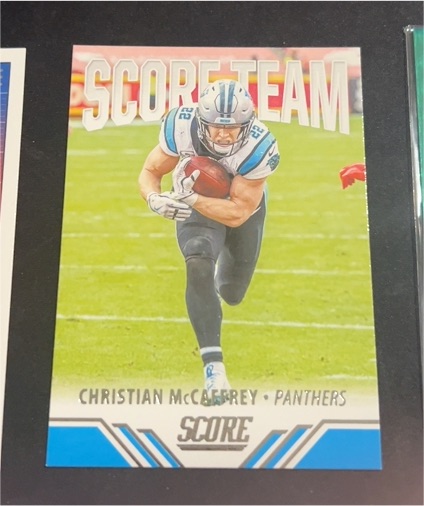 2021 Panini Score #ST7 Christian McCaffrey — front