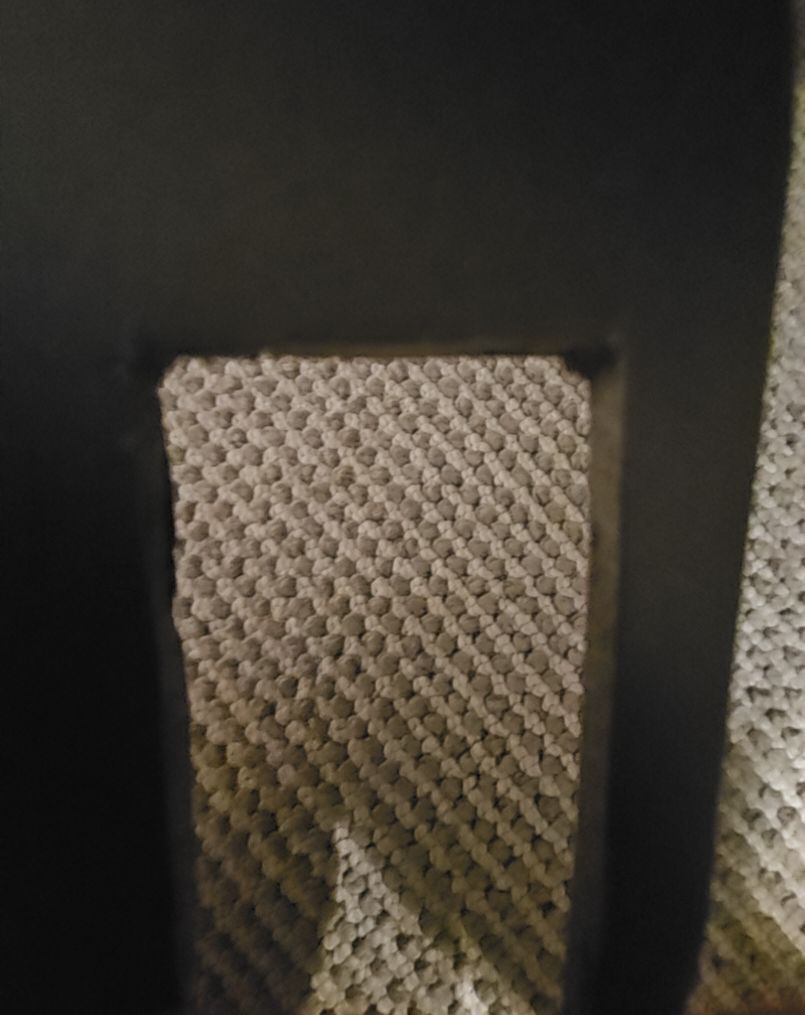 Black Textured Item with Rectangular Cutout — front