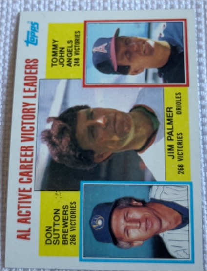 1984 Topps #715 AL Active Career Victory Leaders Jim Palmer / Don Sutton / Tommy John — front