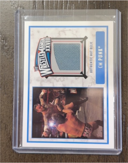 2012 Topps WWE Wrestlemania XXVIII Authentic Mat Relic CM Punk — front