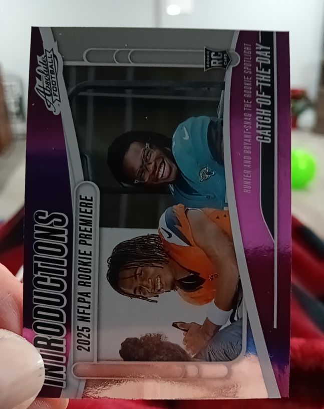 2025 Panini Absolute #I-THR Travis Hunter/Pat Bryant Catch of the Day Introductions Rookie Card — front