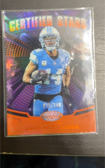 2025 Panini Certified #CST-ASB Amon-Ra St. Brown Certified Stars Orange #/149 — front