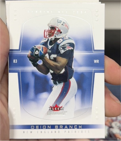 2004 Fleer Genuine #83 Deion Branch — front