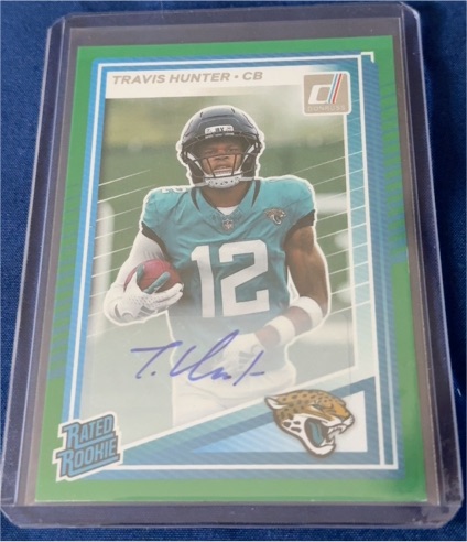 2025 Panini Donruss #301 Travis Hunter Rated Rookie Green Auto — front
