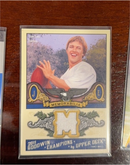 2011 Upper Deck Goodwin Champions #M-JE John Elway Memorabilia — front