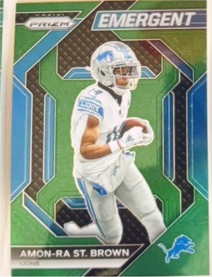 2023 Panini Prizm #H-8 Amon-Ra St. Brown Emergent Prizms Green — front