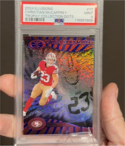 2024 Panini Illusions #77 Christian McCaffrey Trophy Collection Dots — front