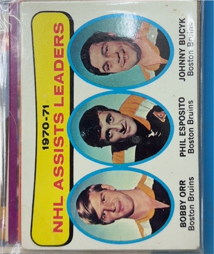1971-72 Topps #2 Bobby Orr/Phil Esposito/Johnny Bucyk NHL Assists Leaders — front