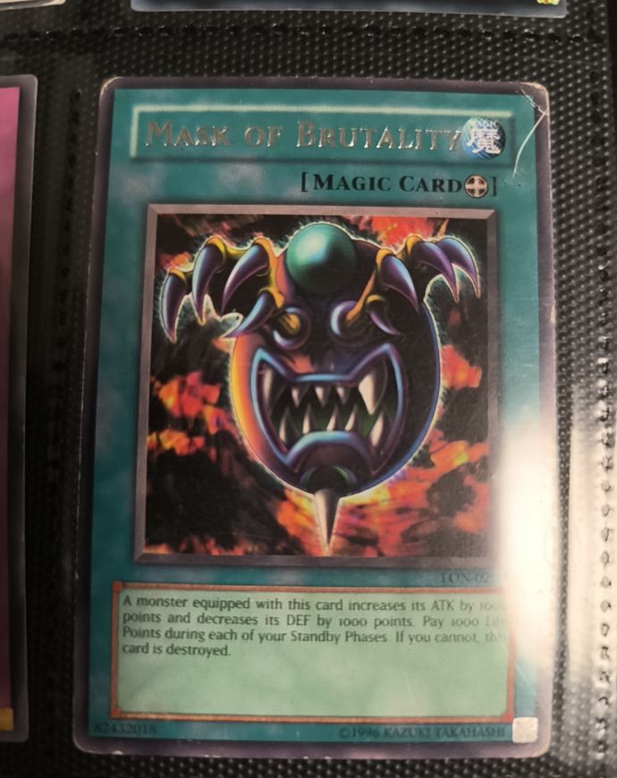 1996 Yu-Gi-Oh! Labyrinth of Nightmare #LON-020 Mask of Brutality — front