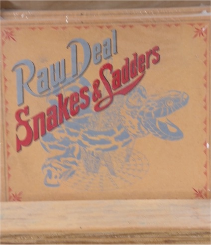2004 Raw Deal Snakes & Ladders — front